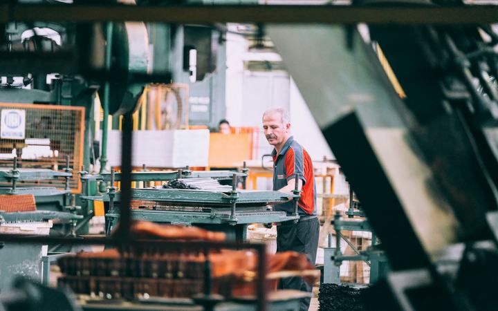 Engineer operating industrial machinery