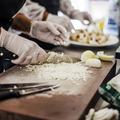 Food handlers in gloves preparing food