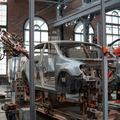 Car body being assembled by robots