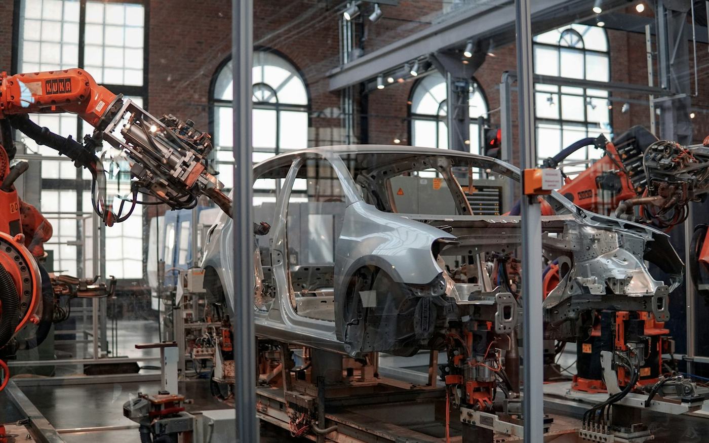 Car body being assembled by robots