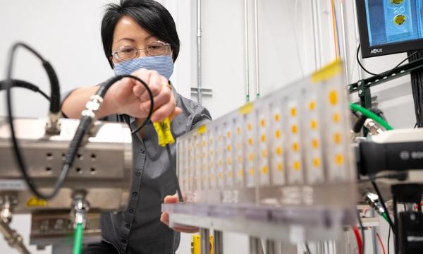 Scientist calibrating laboratory test equipment