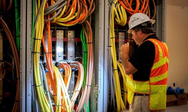 Building inspector checking electrical services
