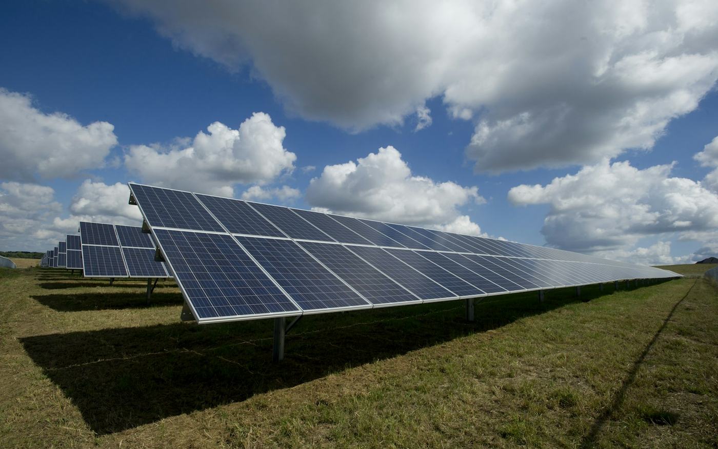 Solar panels on a green field