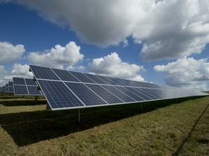 Solar panels on a green field