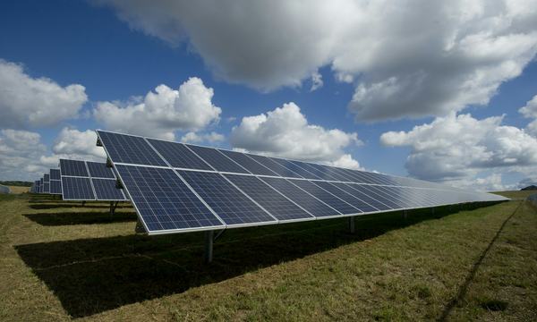 Solar panels on a green field