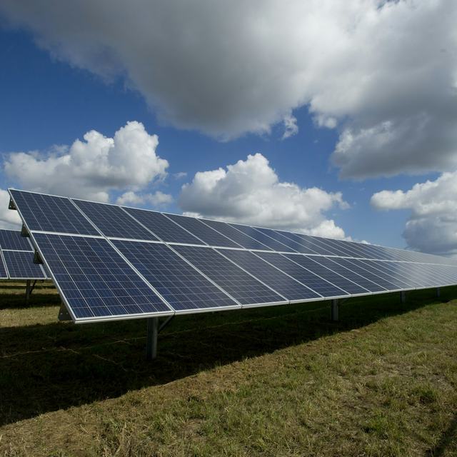 Solar panels on a green field