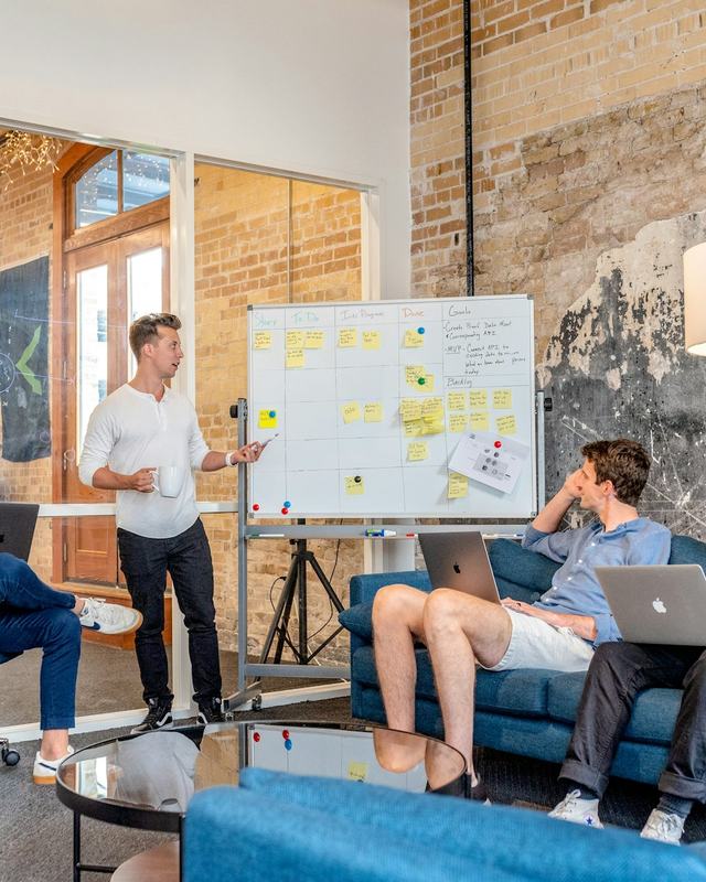 Team meeting in front of a whiteboard