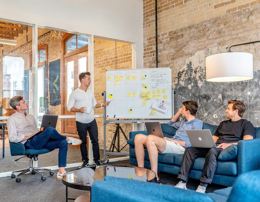 Team meeting in front of a whiteboard
